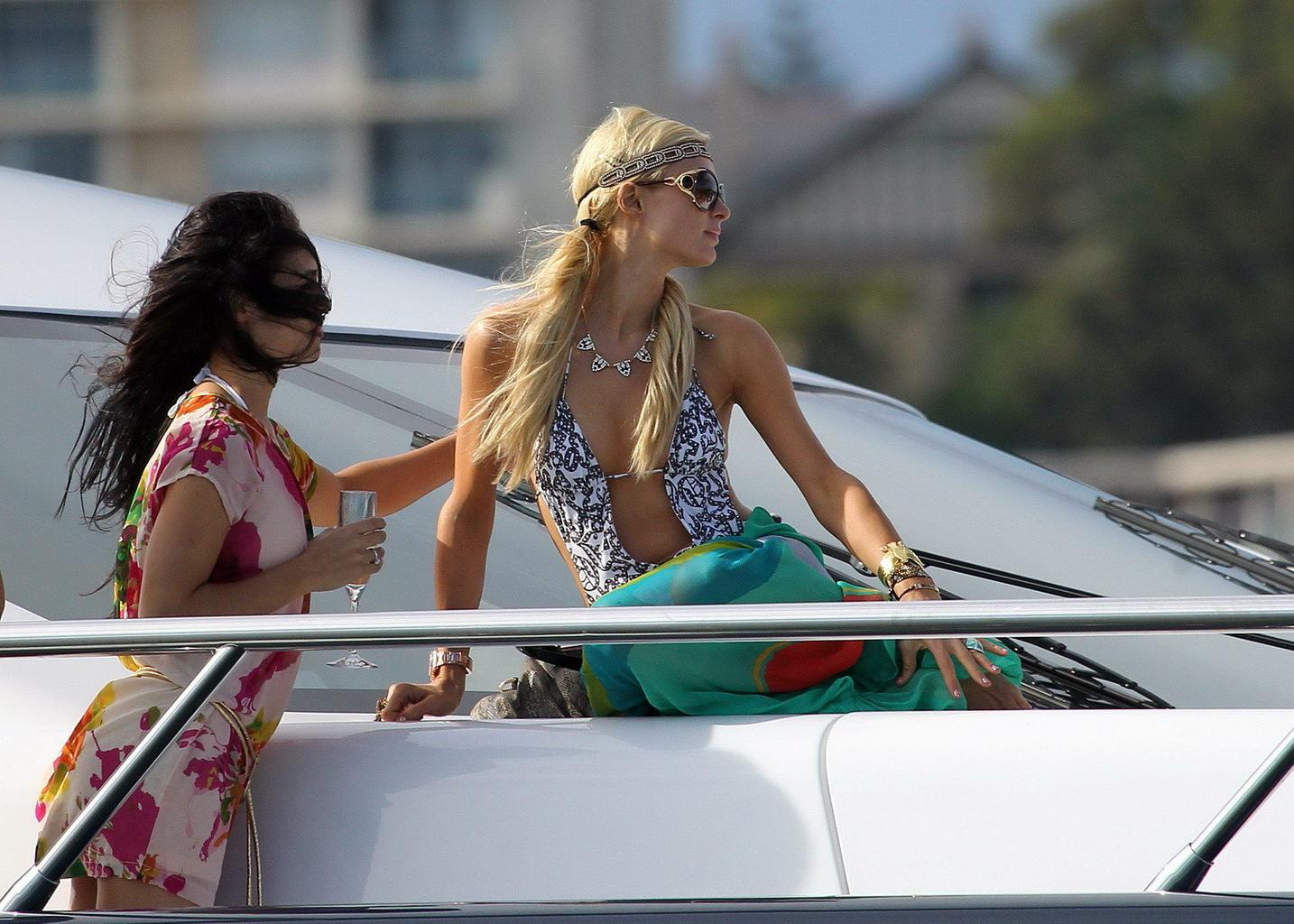 16P Paris Hilton showing her hot ass in deep cut swimsuit at the yacht in Sydney Har