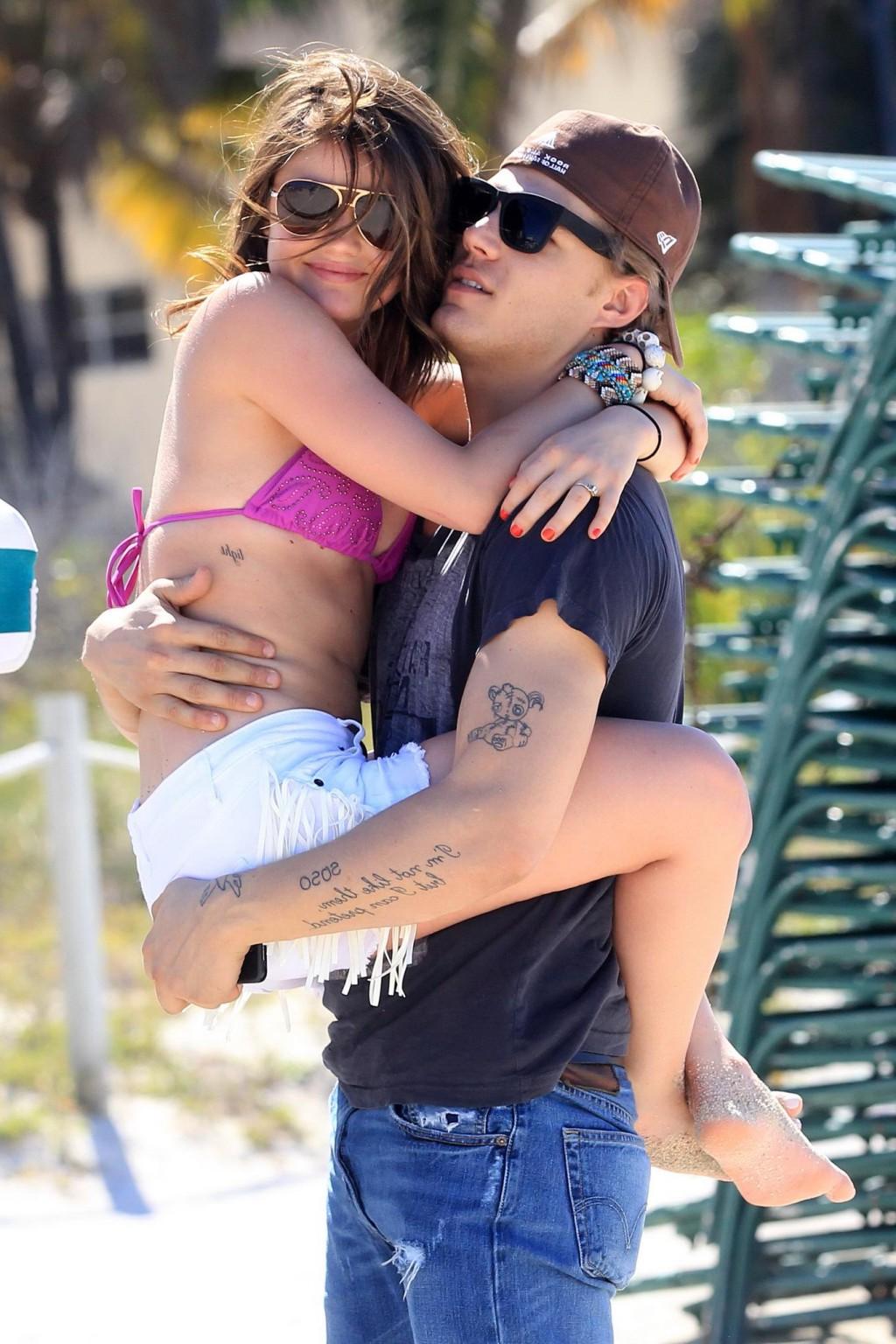 16P Lucy Hale in bikini top  shorts humping her boyfriend at the 'Bongo Meet 'n' Gre