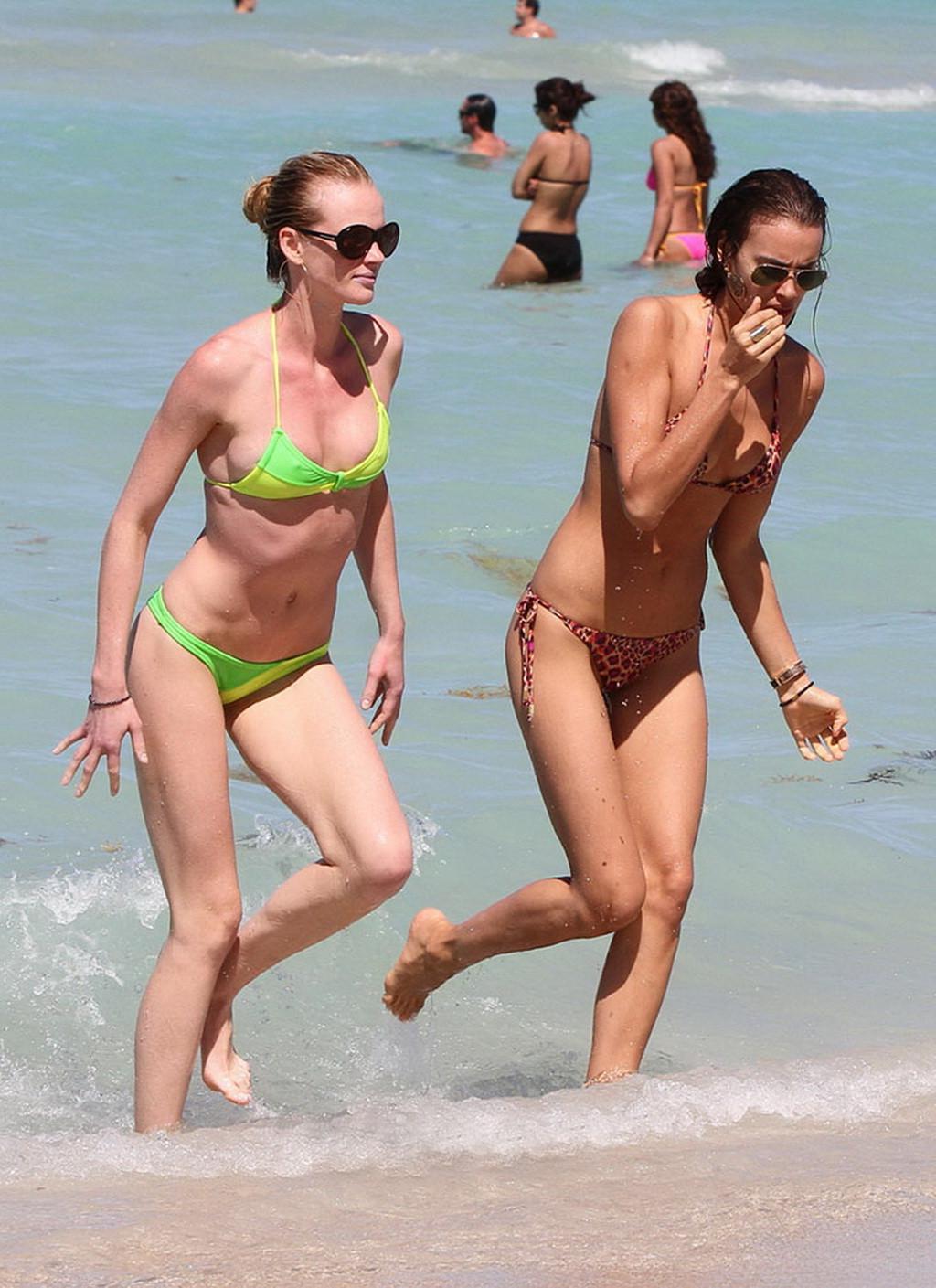 16P Irina Shayk shows off her ass wearing a thong bikini at the beach in Miami