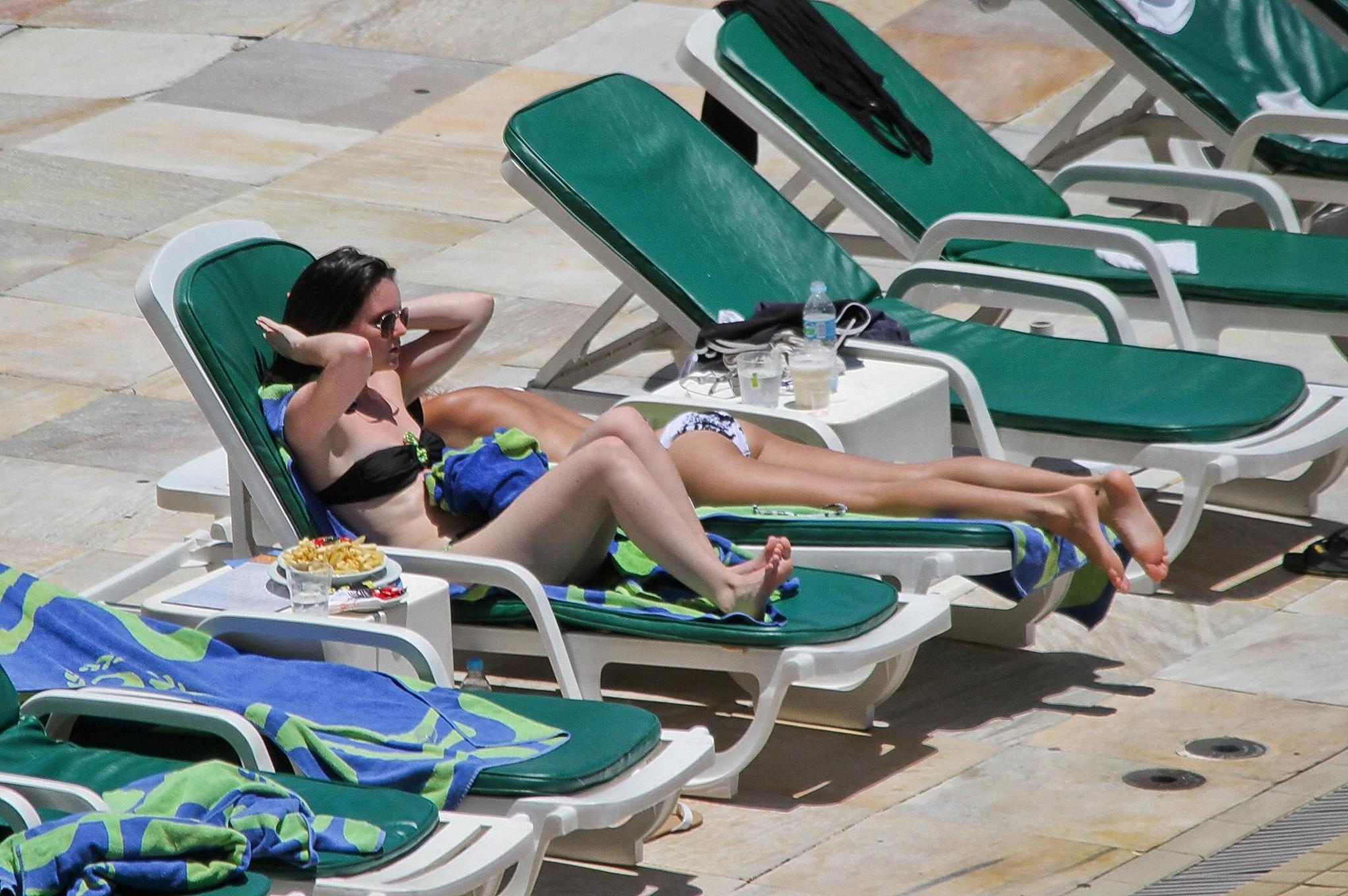 16P Selena Gomez sunbathing topless poolside in Rio de Janeiro