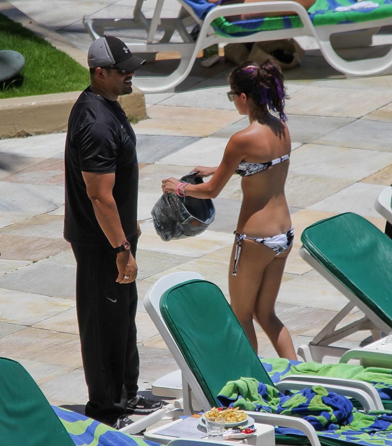 16P Selena Gomez sunbathing topless poolside in Rio de Janeiro