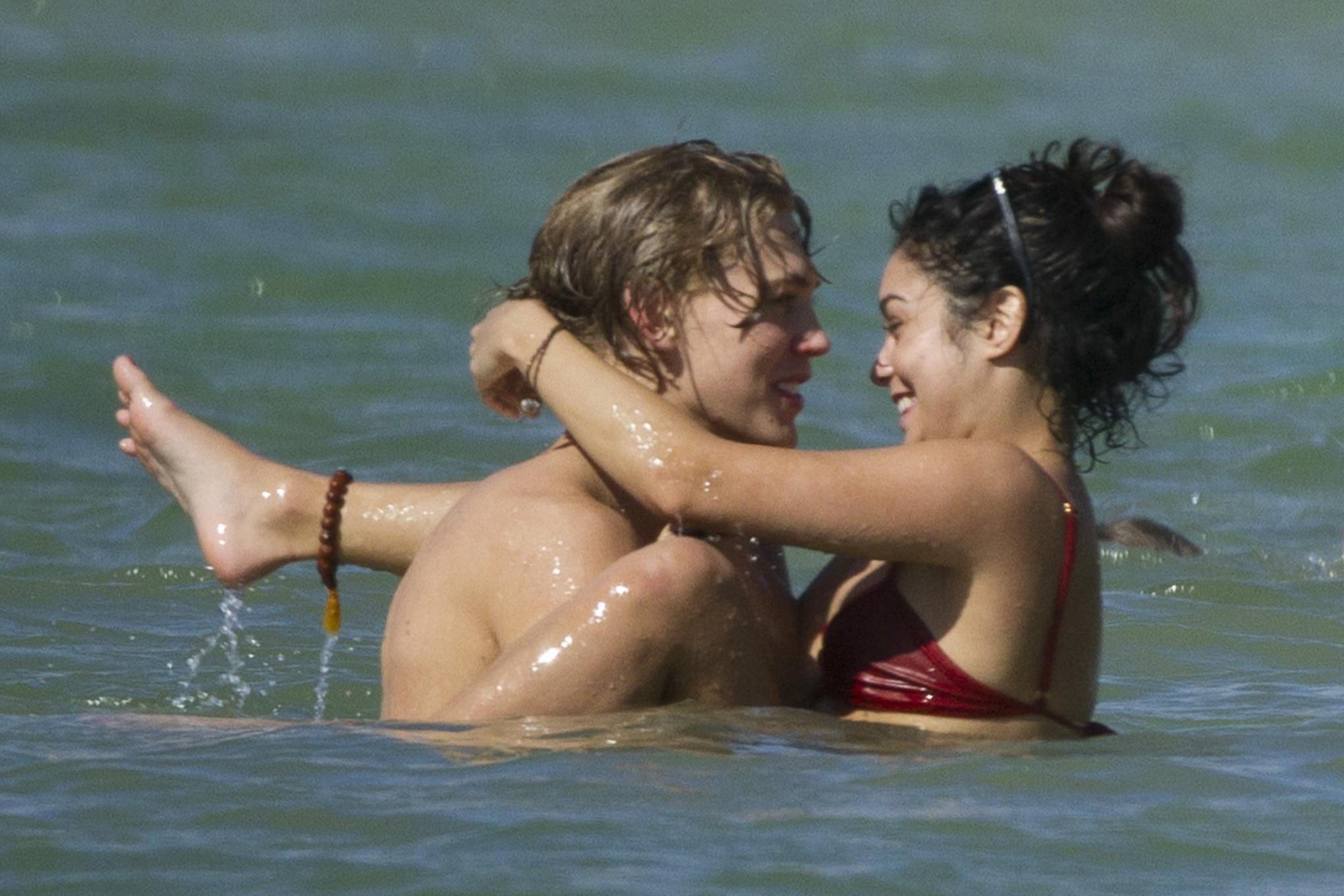 16P Vanessa Hudgens in sexy red bikini making out with her boyfriend on a Hawaiian b