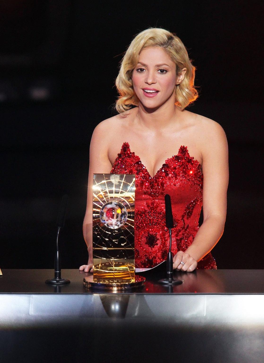 16P Shakira shows cleavage wearing strapless red dress at the FIFA Ballon d'Or Socce