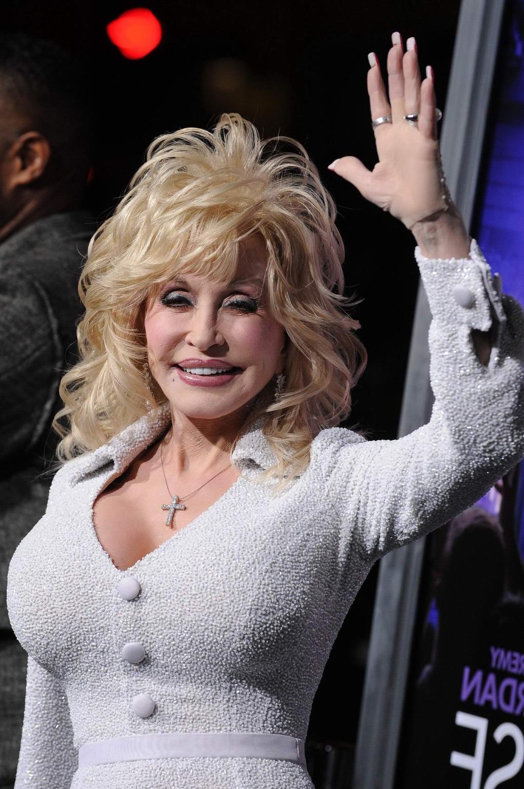 16P Dolly Parton busty wearing tight white dress at the 'Joyful Noise' premiere in L