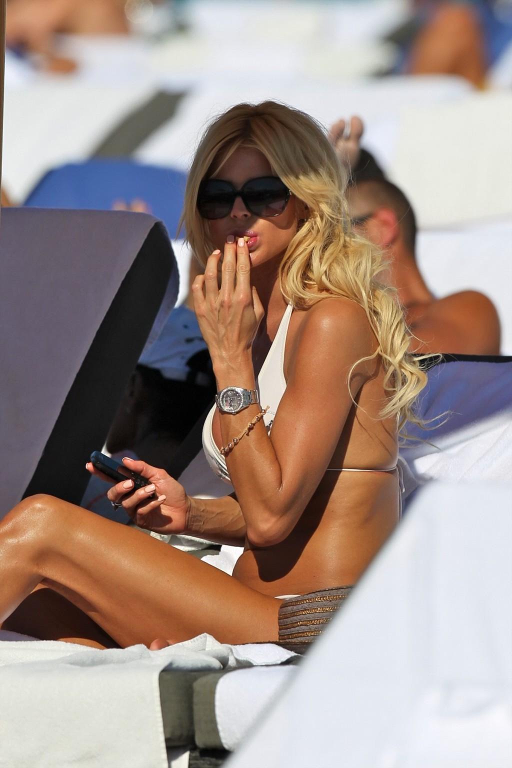 16P Victoria Silvstedt wearing skimpy white bikini on a beach in Miami