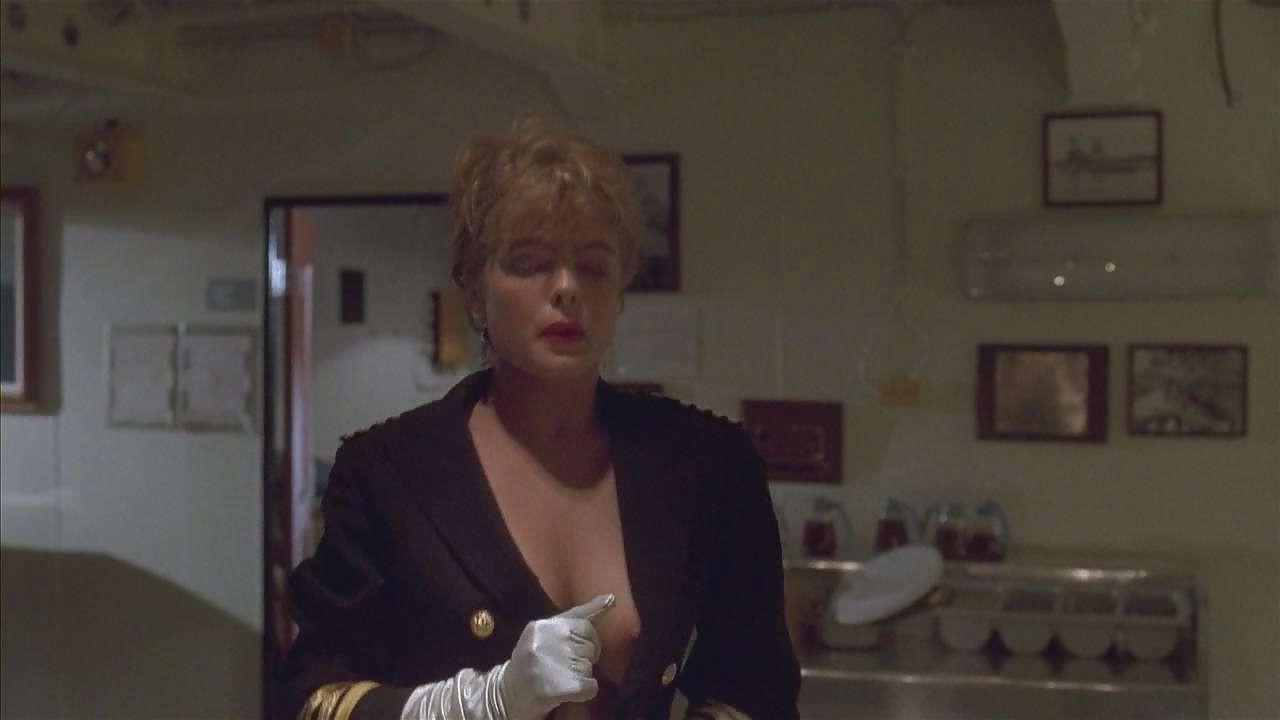 16P Erika Eleniak showing her nice big tits and ass in thong