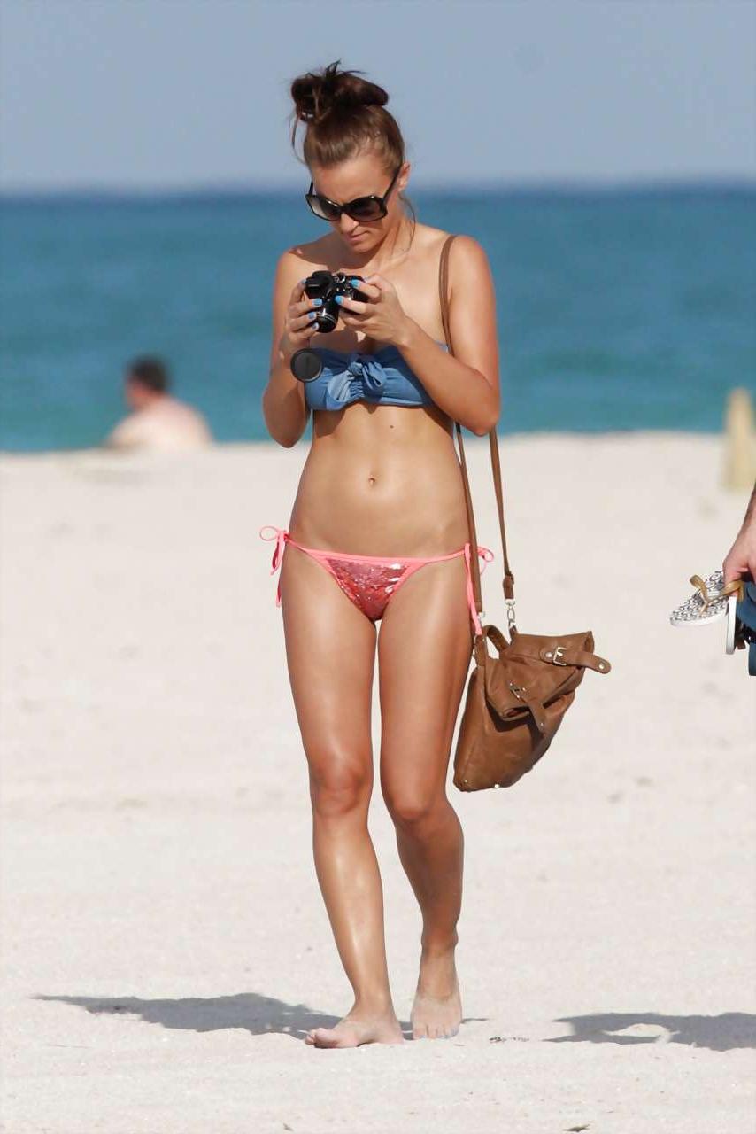 16P Rosie Jones exposing her nice big tits on beach paparazzi pictures