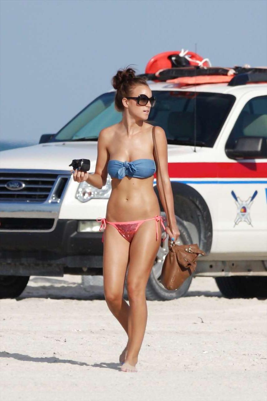16P Rosie Jones exposing her nice big tits on beach paparazzi pictures