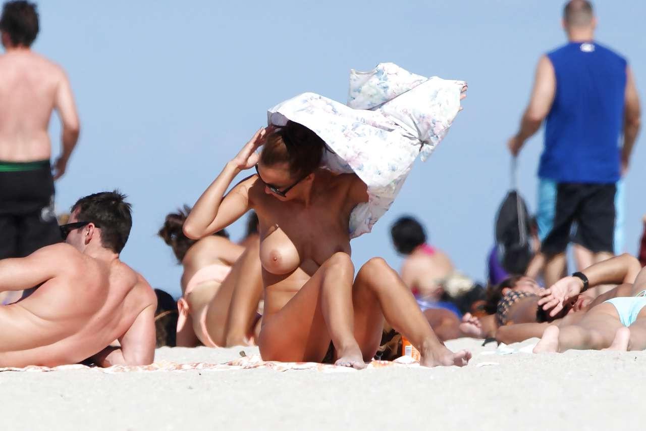 16P Rosie Jones exposing her nice big tits on beach paparazzi pictures