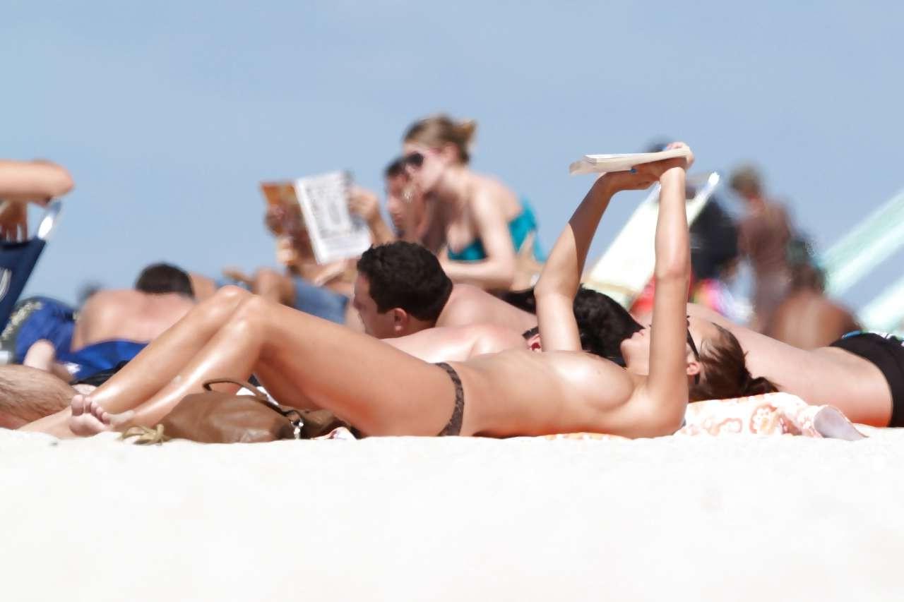 16P Rosie Jones exposing her nice big tits on beach paparazzi pictures