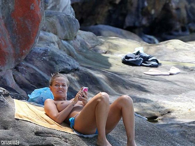 16P Lara Bingle topless sunbathing on beach paparazzi photos