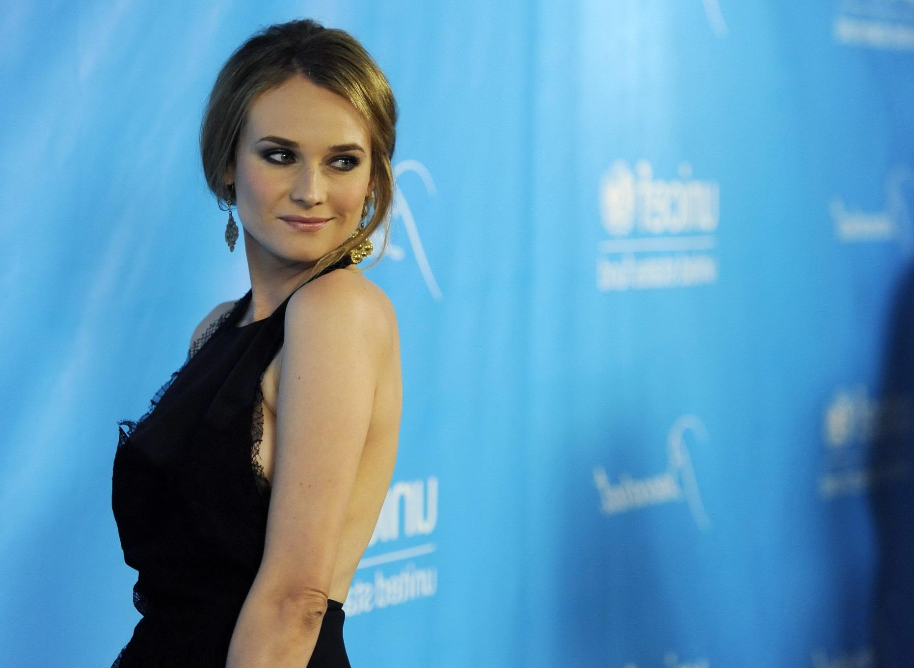 16P Diane Kruger shows side boob wearing black dress at the 2011 UNICEF Ball in Los 
