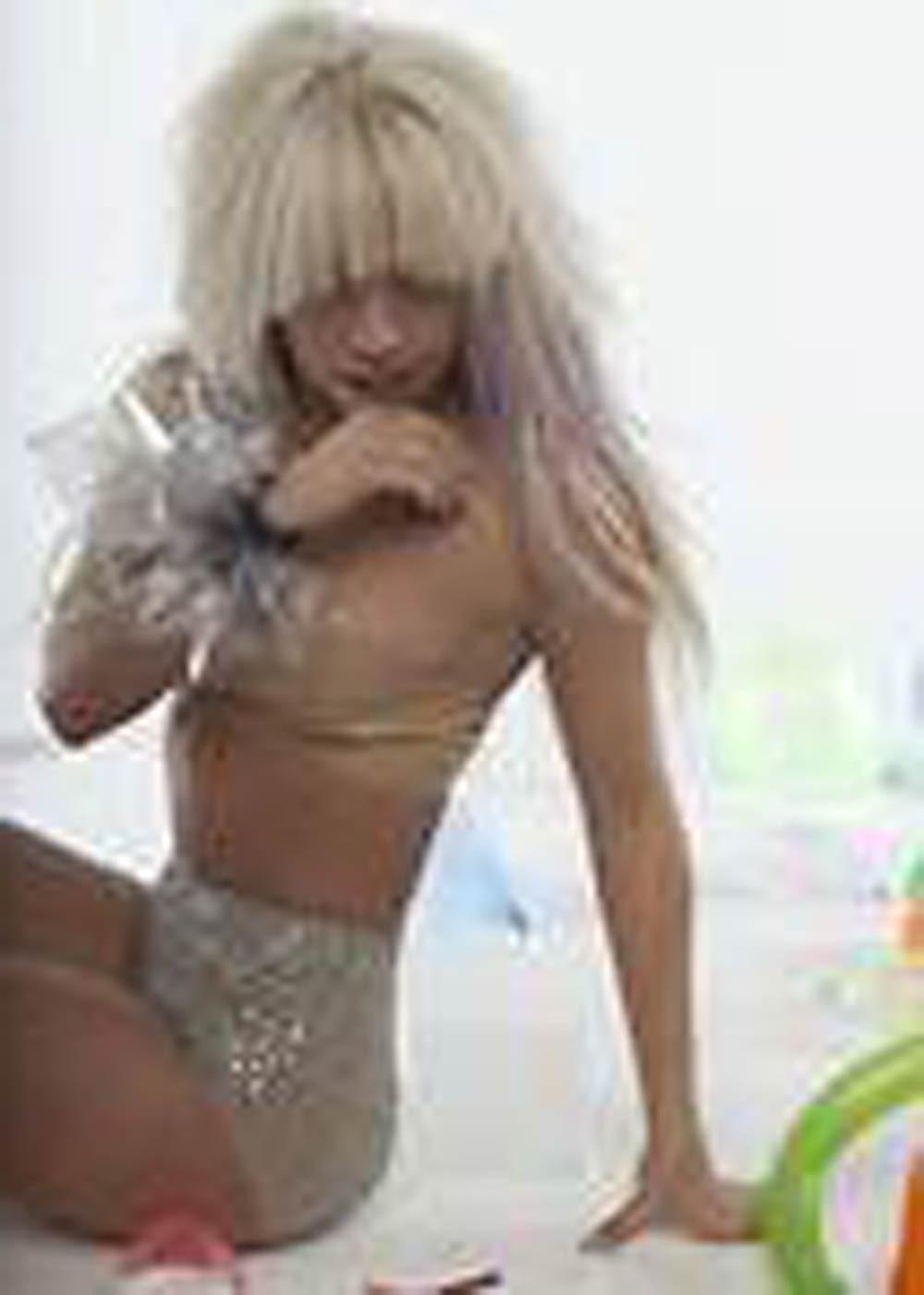 16P Lady Gaga showing tits under her see thru dress