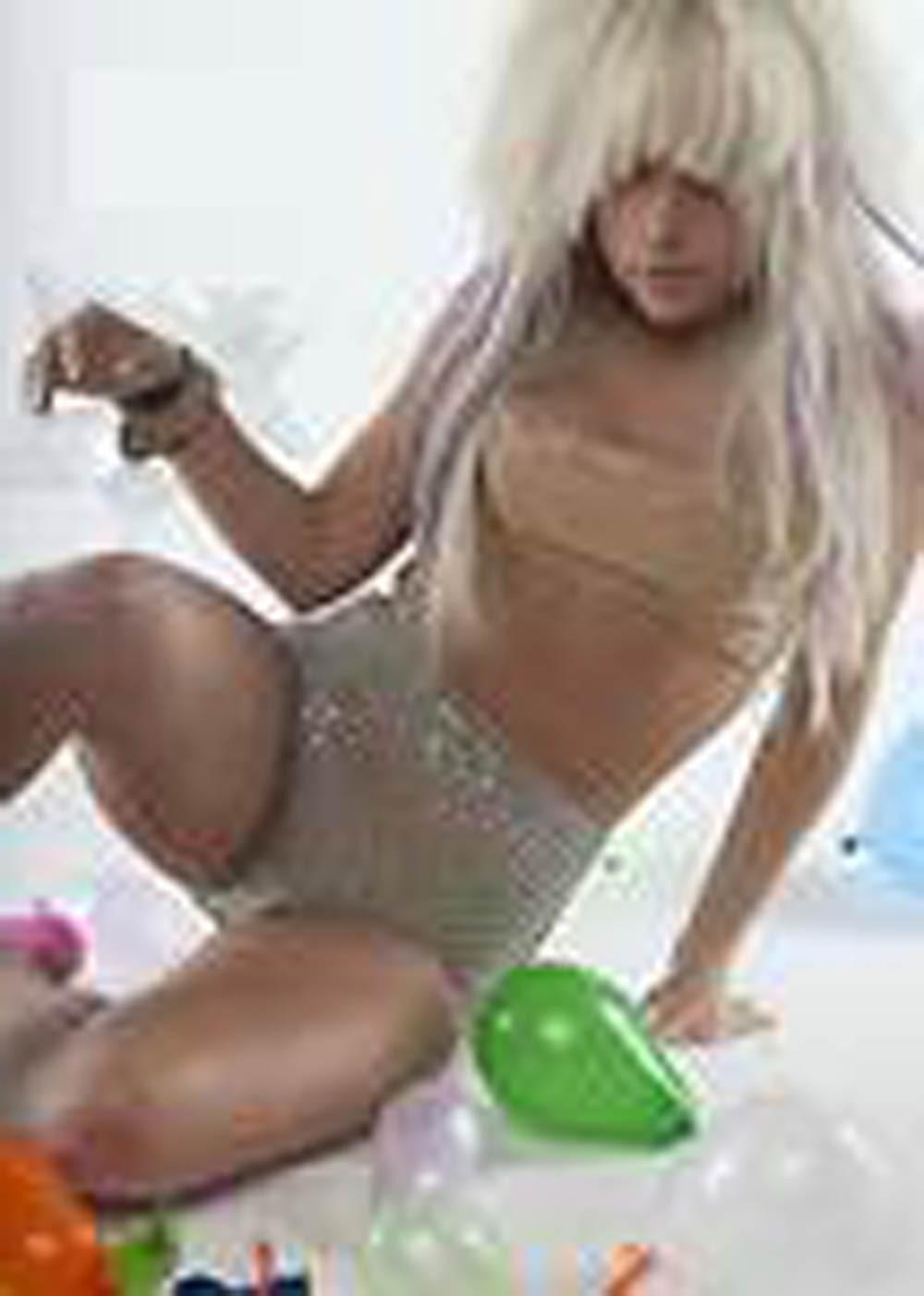 16P Lady Gaga showing tits under her see thru dress