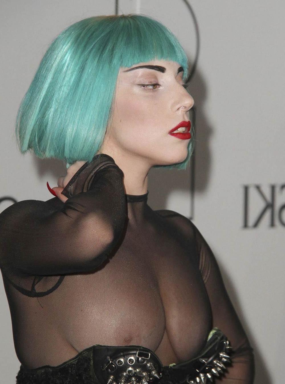 16P Lady Gaga showing tits under her see thru dress