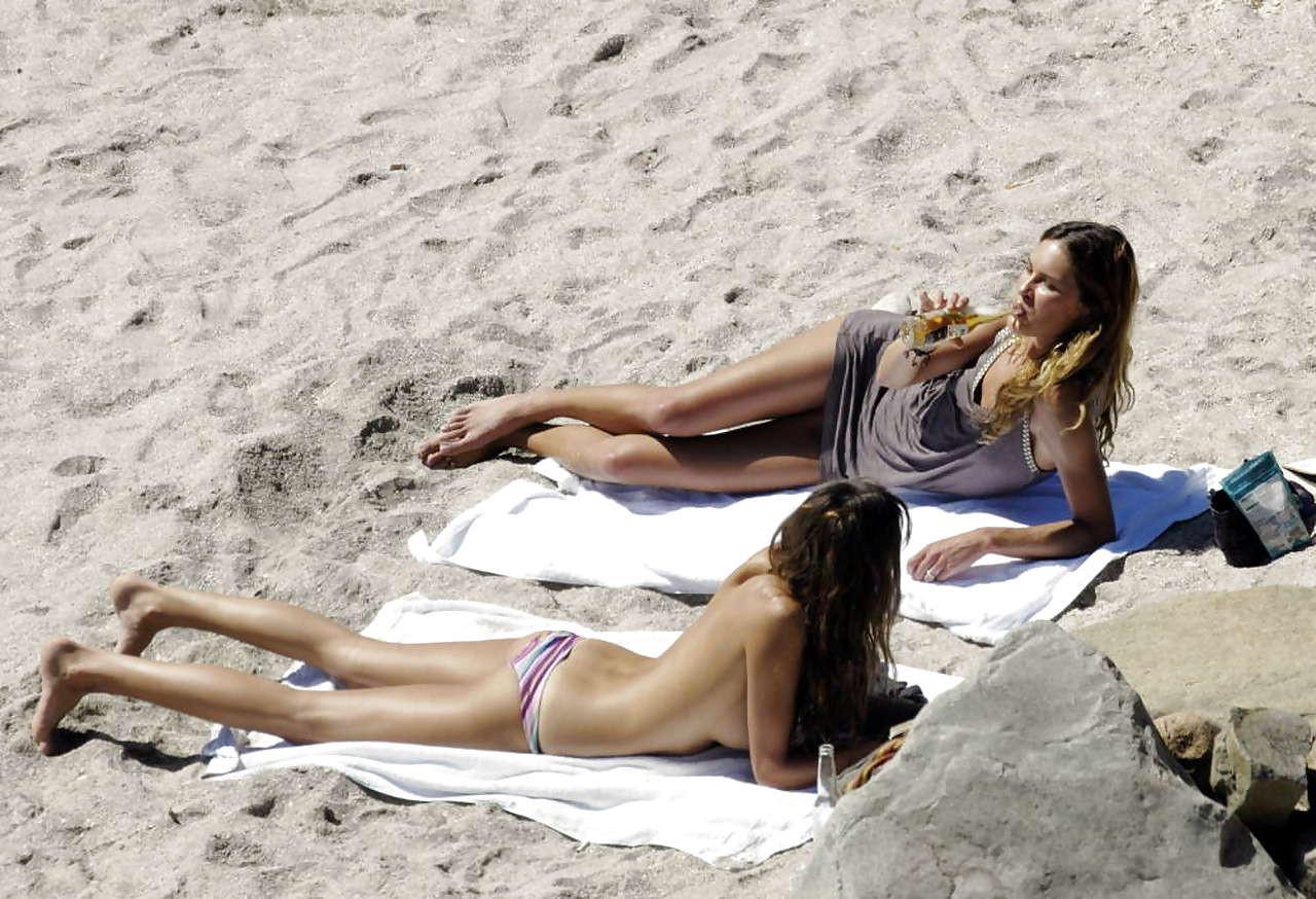 16P Daria Werbowy showing her big boobs sunbathing topless with friend