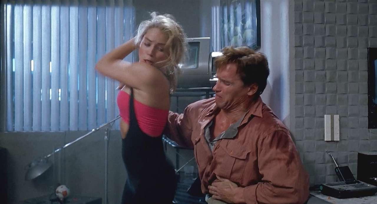 16P Sharon Stone show big cleavage in red top and exposing her tits