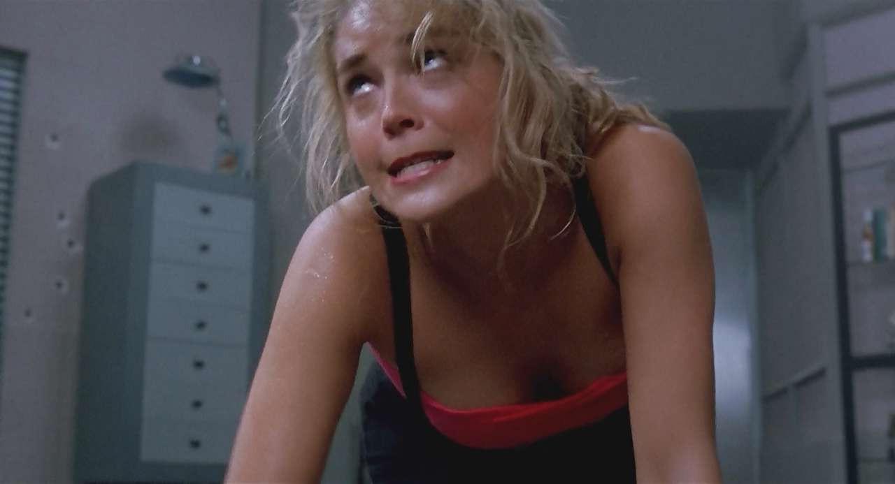 16P Sharon Stone show big cleavage in red top and exposing her tits