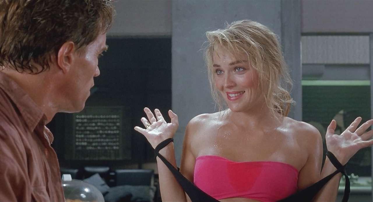 16P Sharon Stone show big cleavage in red top and exposing her tits