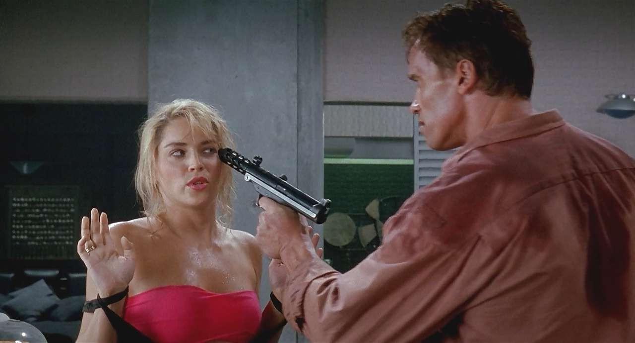 16P Sharon Stone show big cleavage in red top and exposing her tits