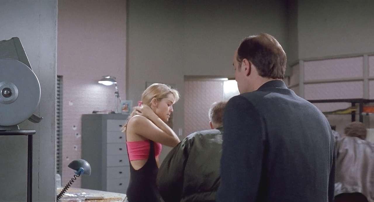 16P Sharon Stone show big cleavage in red top and exposing her tits