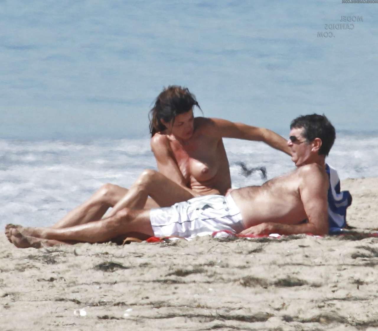 16P Janice Dickinson showing her nice big tits on beach paparazzi pictures