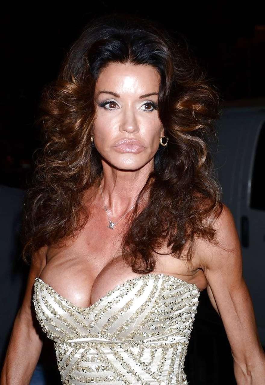 16P Janice Dickinson showing her nice big tits on beach paparazzi pictures