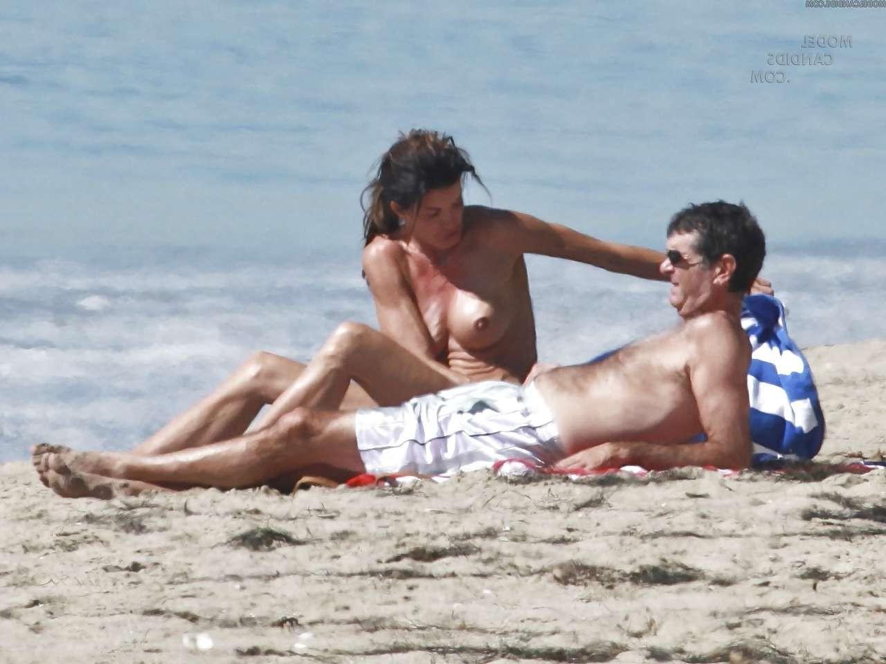 16P Janice Dickinson showing her nice big tits on beach paparazzi pictures