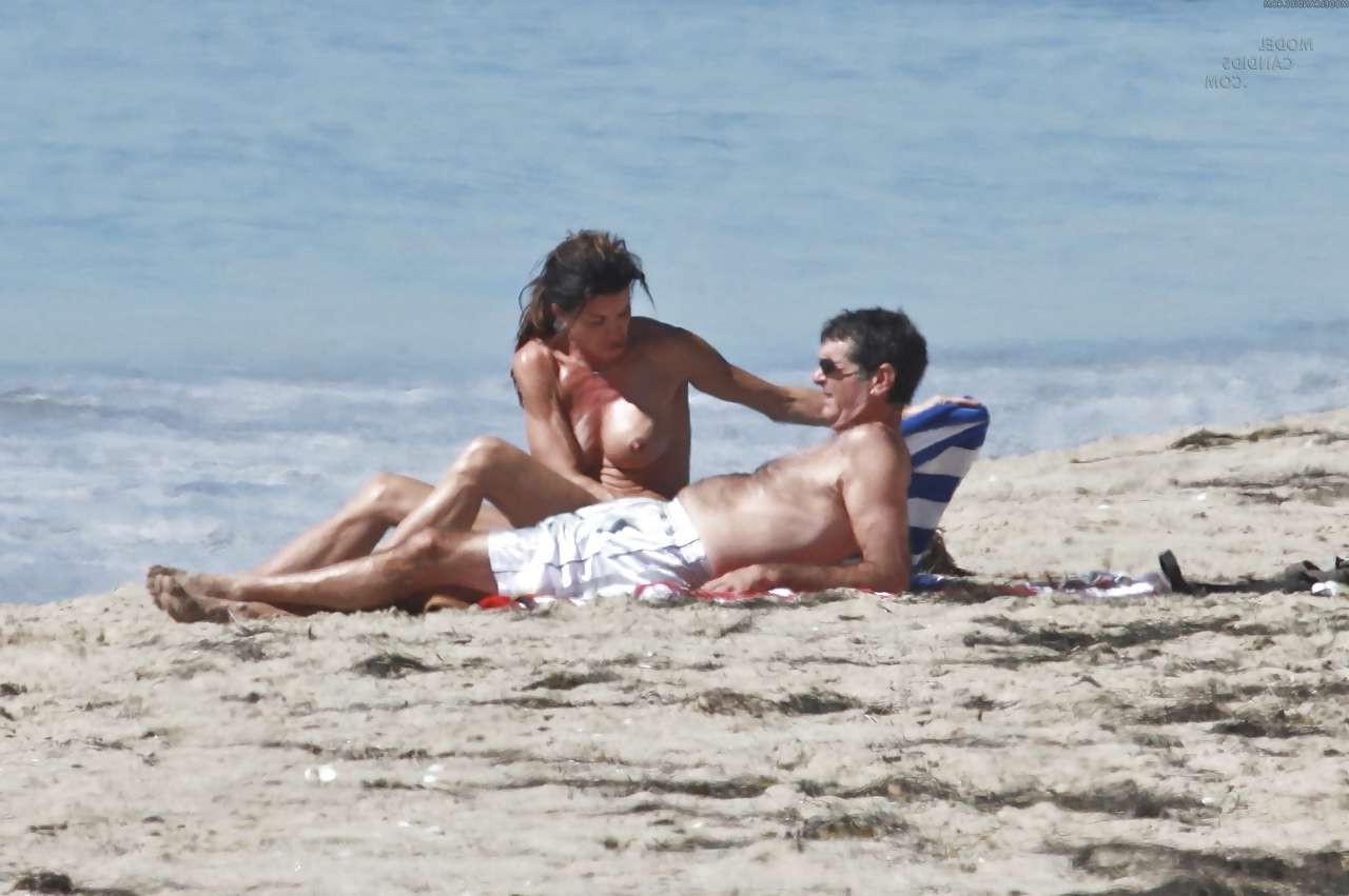 16P Janice Dickinson showing her nice big tits on beach paparazzi pictures