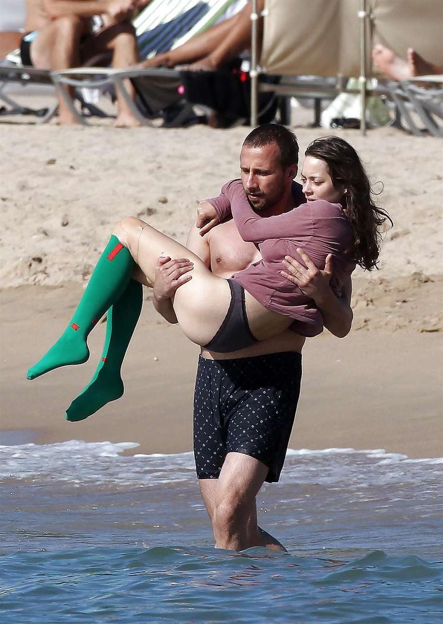16P Marion Cotillard showing her nice big tits on beach with friend paparazzi pictur