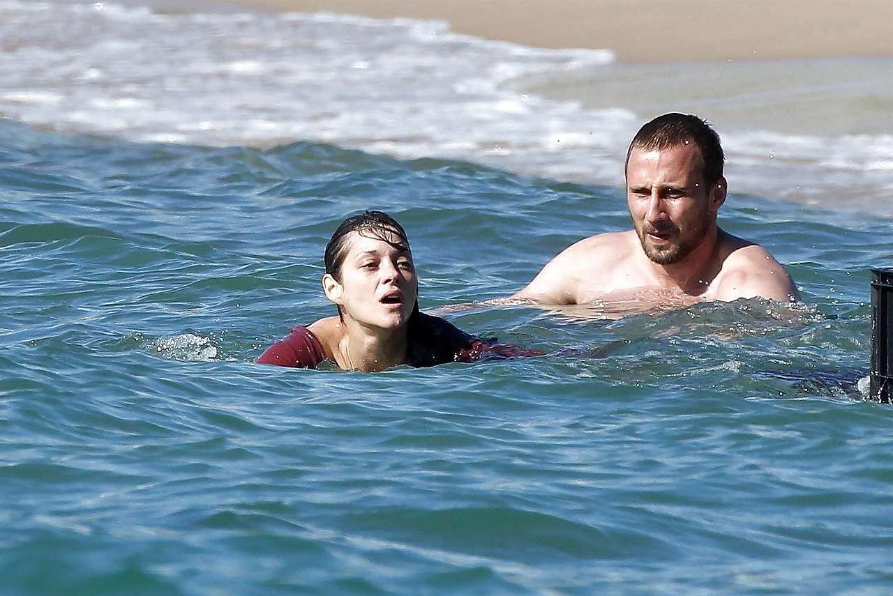 16P Marion Cotillard showing her nice big tits on beach with friend paparazzi pictur