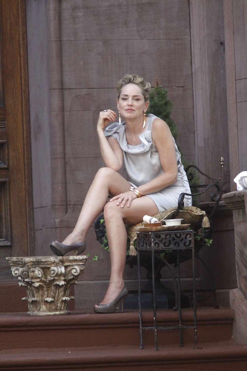 16P Sharon Stone showing her panties upskirt while spread cream on her legs