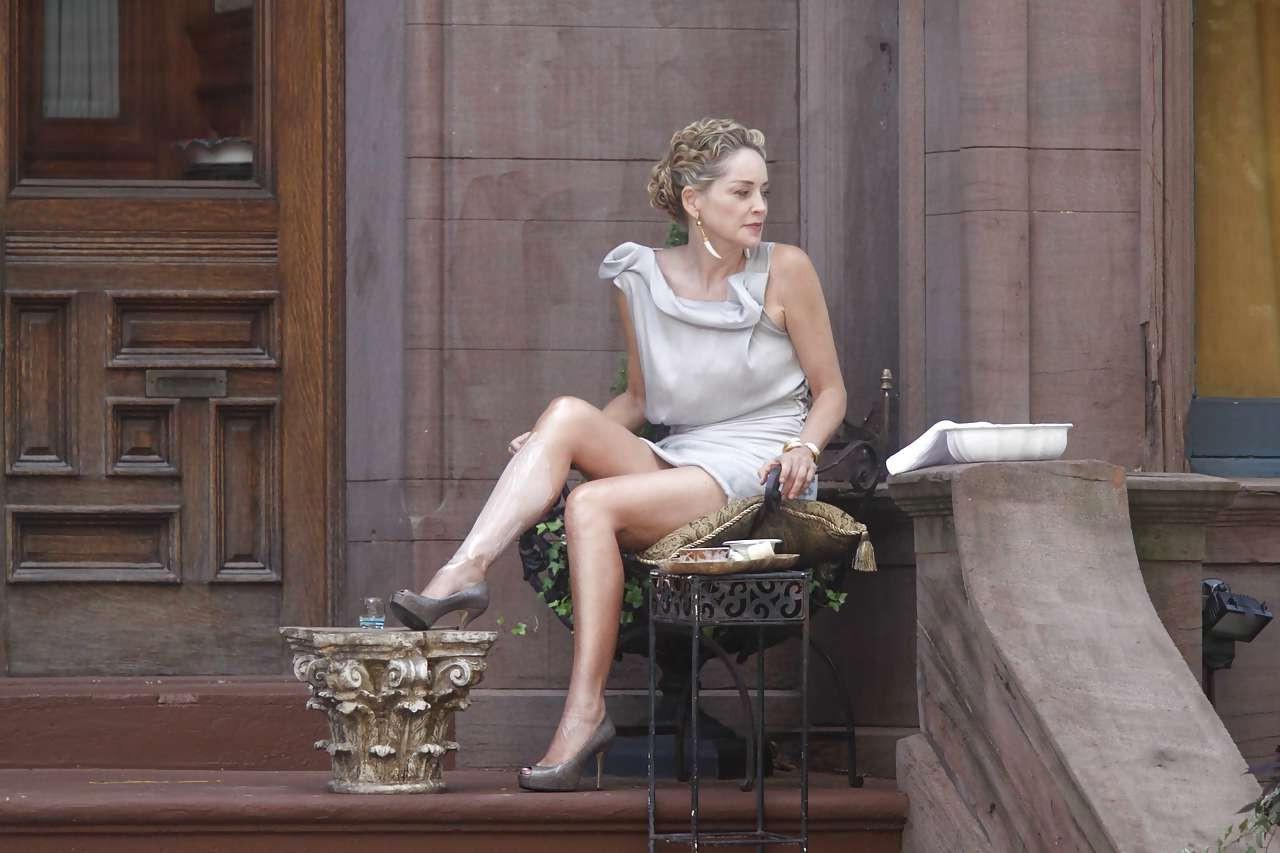 16P Sharon Stone showing her panties upskirt while spread cream on her legs