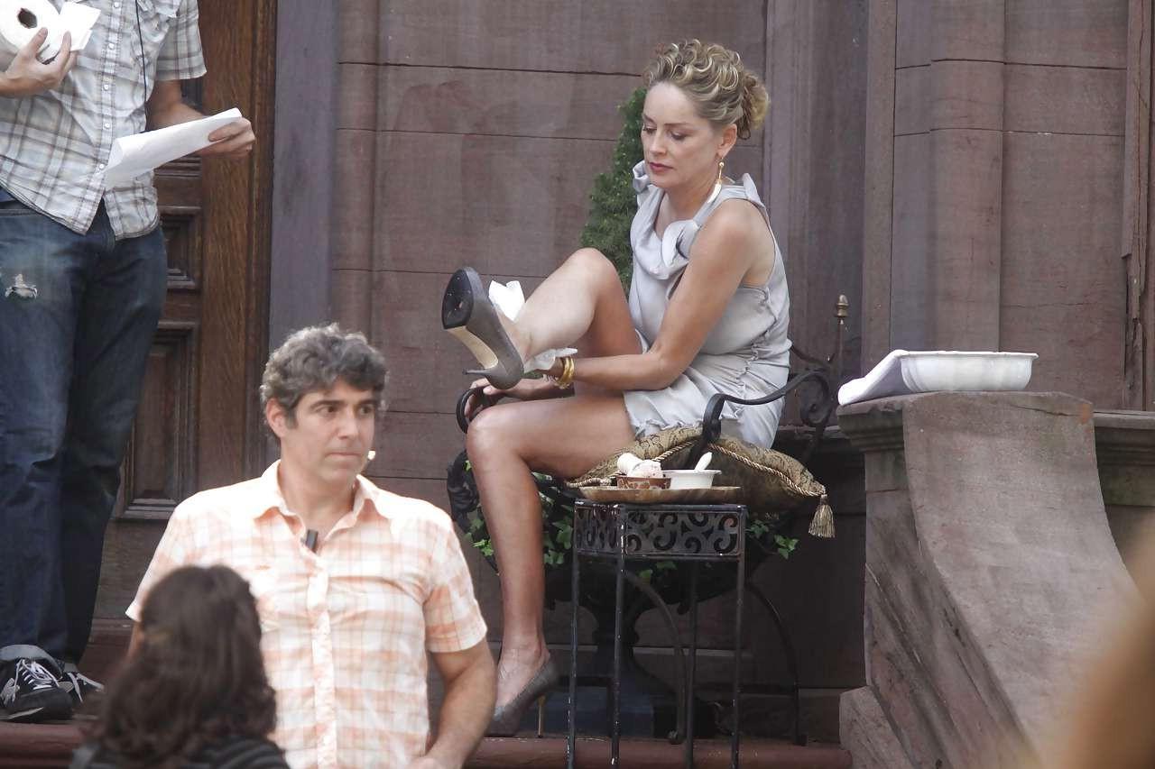 16P Sharon Stone showing her panties upskirt while spread cream on her legs