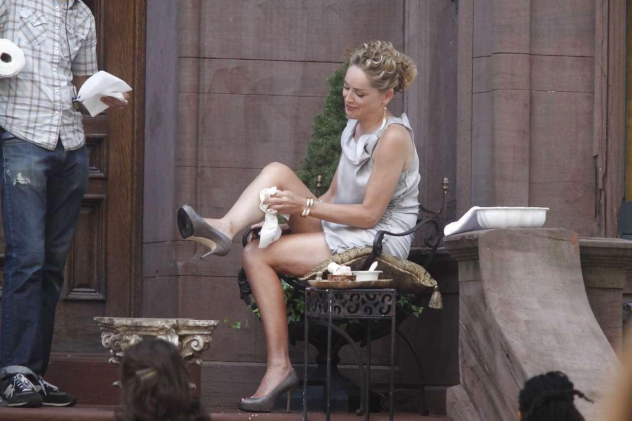 16P Sharon Stone showing her panties upskirt while spread cream on her legs