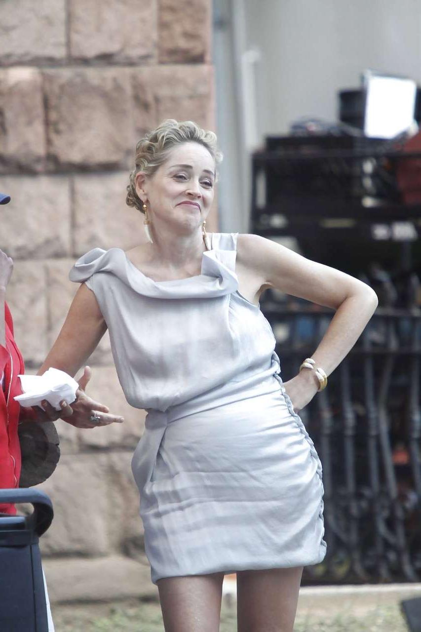 16P Sharon Stone showing her panties upskirt while spread cream on her legs