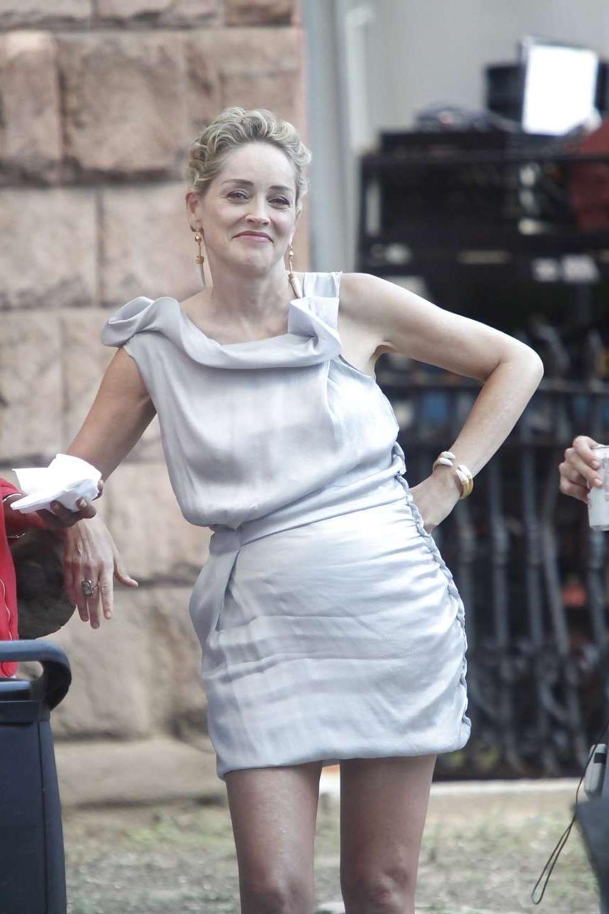 16P Sharon Stone showing her panties upskirt while spread cream on her legs