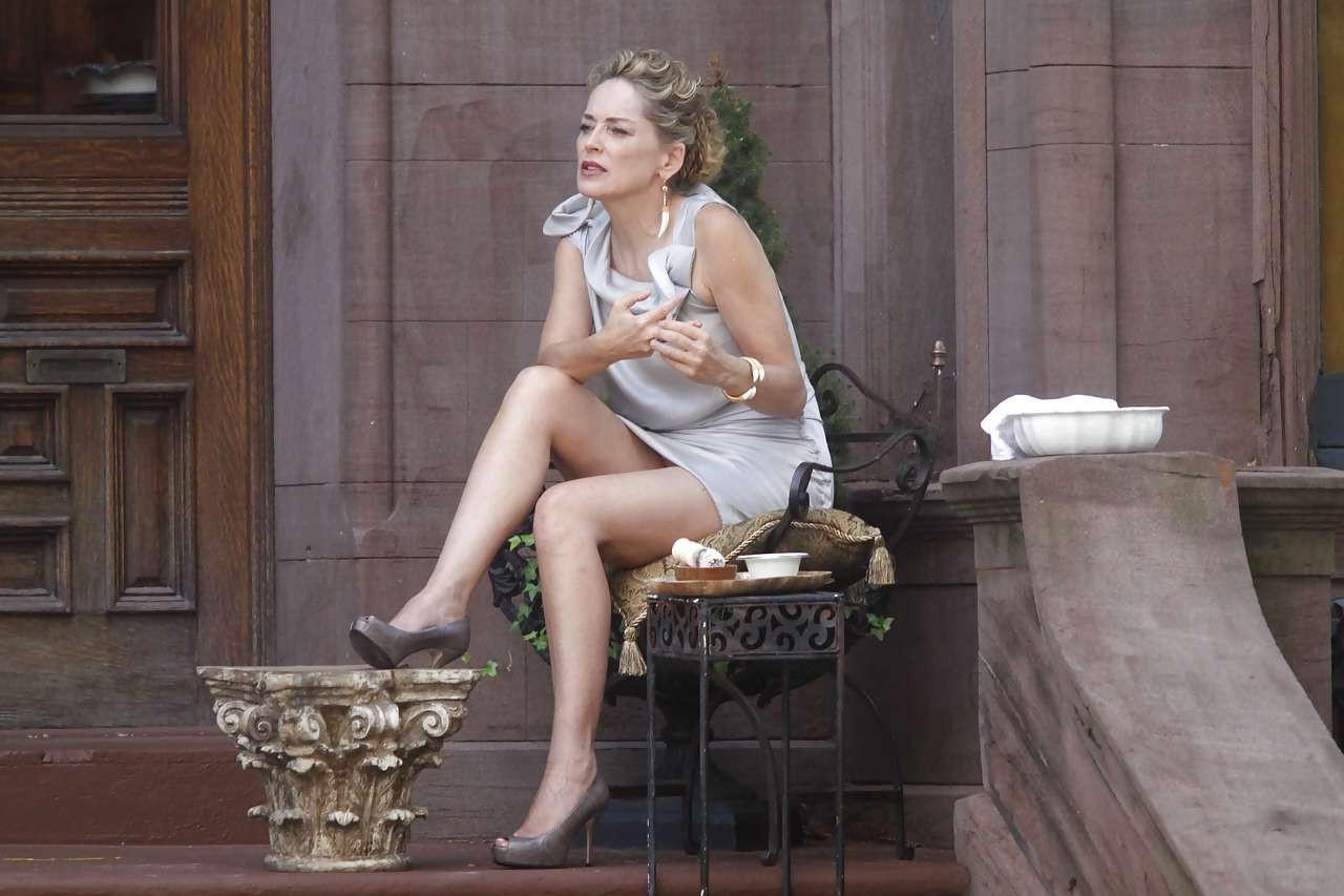 16P Sharon Stone showing her panties upskirt while spread cream on her legs
