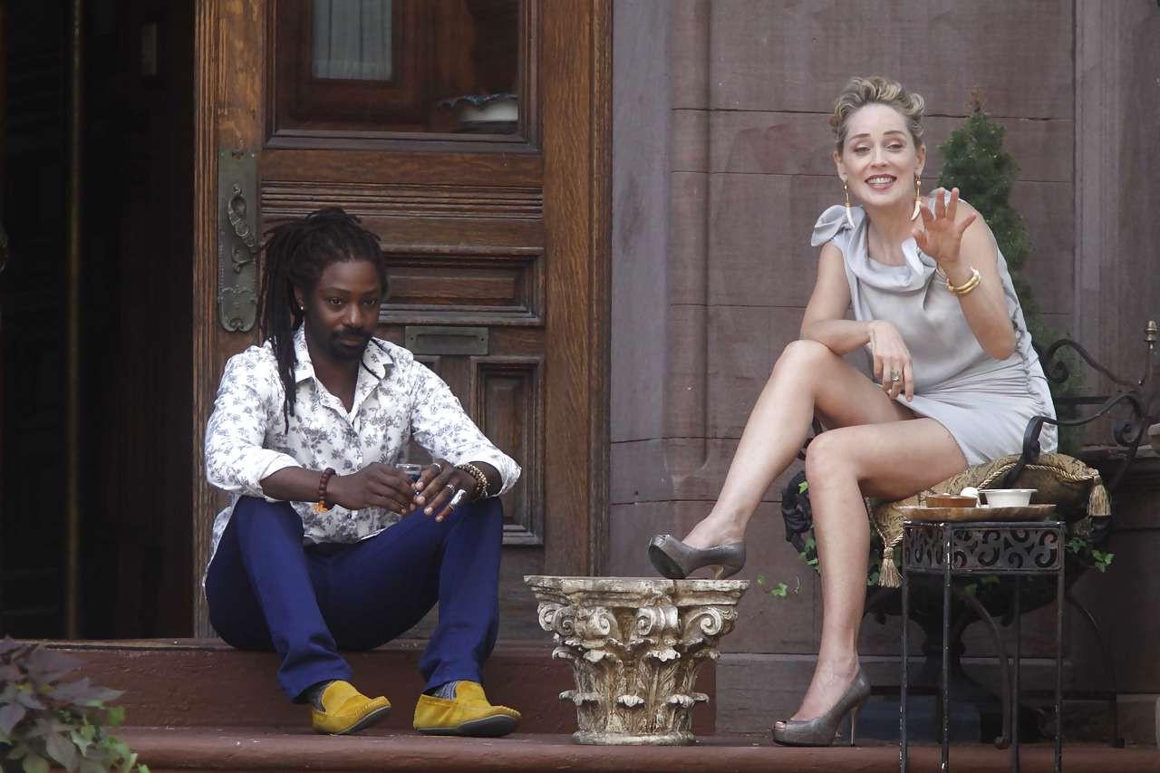 16P Sharon Stone showing her panties upskirt while spread cream on her legs