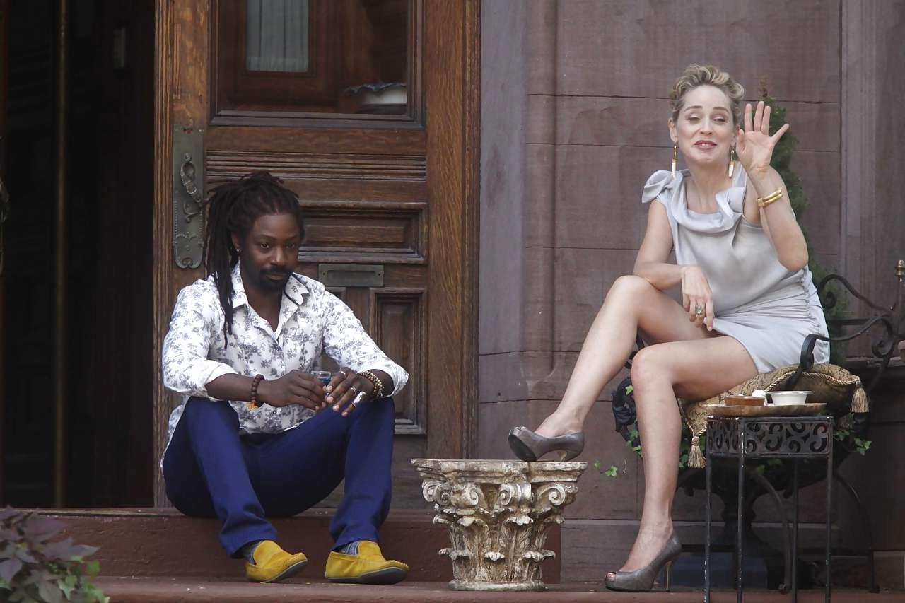 16P Sharon Stone showing her panties upskirt while spread cream on her legs