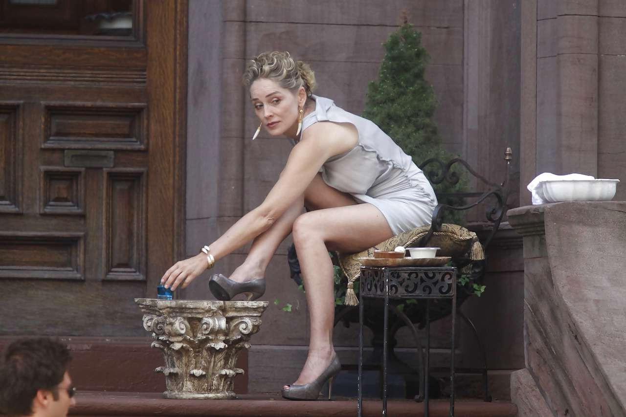 16P Sharon Stone showing her panties upskirt while spread cream on her legs