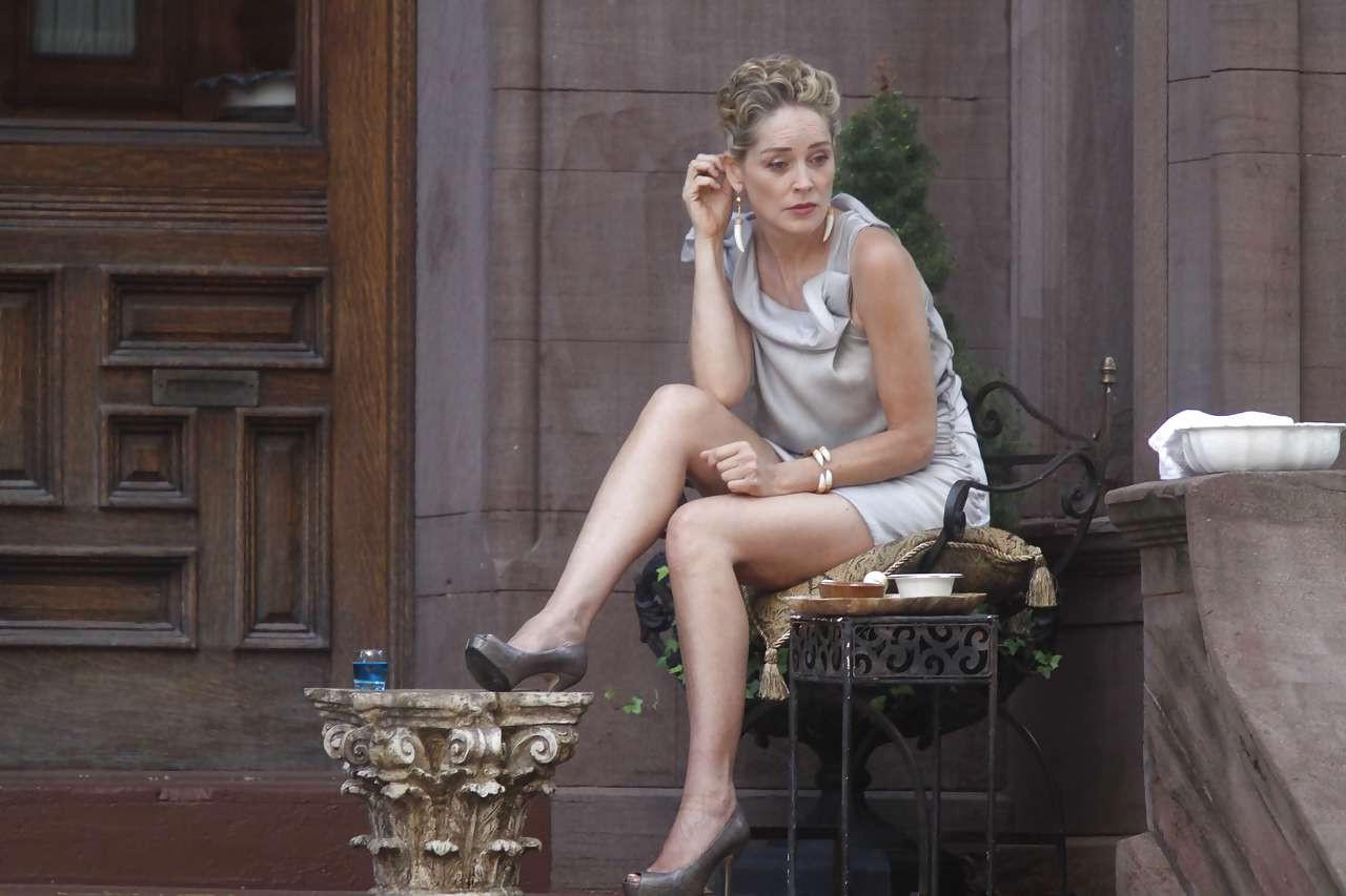16P Sharon Stone showing her panties upskirt while spread cream on her legs