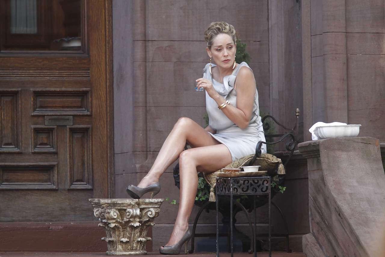 16P Sharon Stone showing her panties upskirt while spread cream on her legs