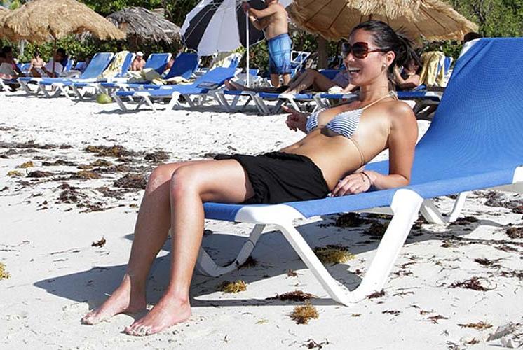 16P Olivia Munn exposing her sexy body and hot ass in bikini on beach