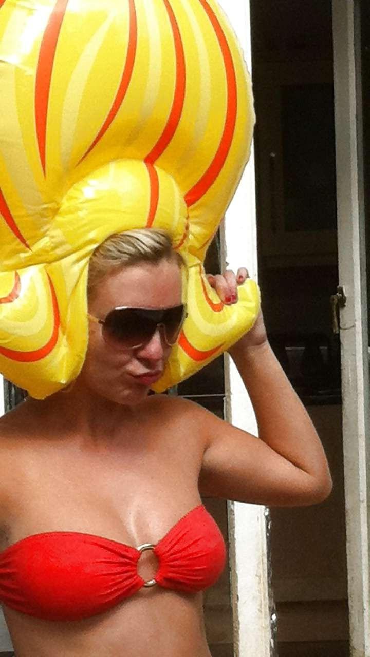 16P Sheridan Smith topless but covered with hands and in stockings paparazzi picture