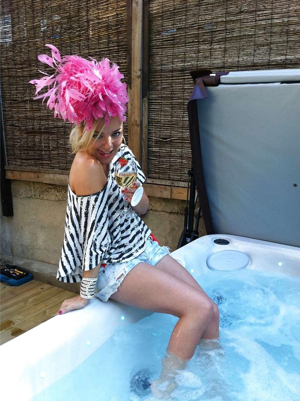 16P Sheridan Smith topless but covered with hands and in stockings paparazzi picture