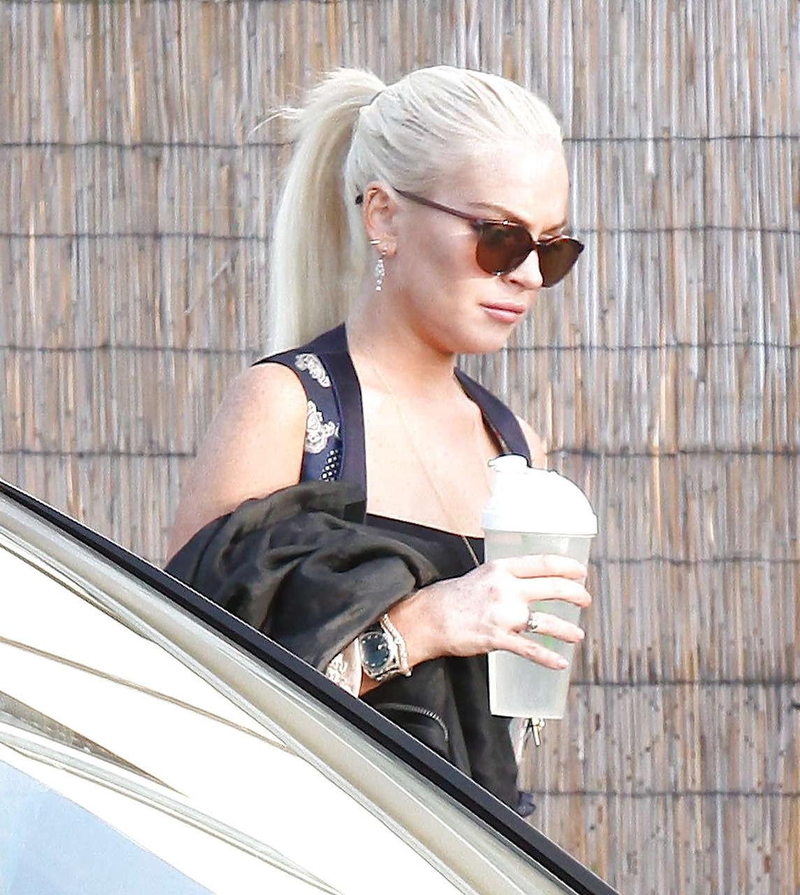 16P Lindsay Lohan showing her nice big tits in see thru top paparazzi pictures