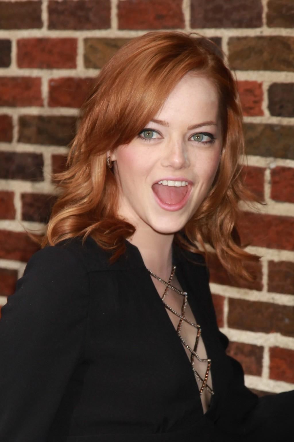 16P Emma Stone leggy wearing black mini dress outside the Ed Sullivan Theater in NYC