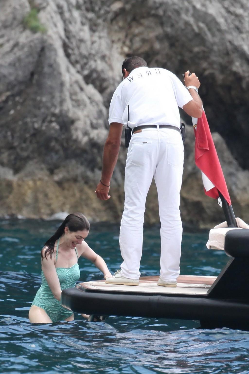 16P Anne Hathaway shows pokies wearing skimpy wet swimsuit in Italy