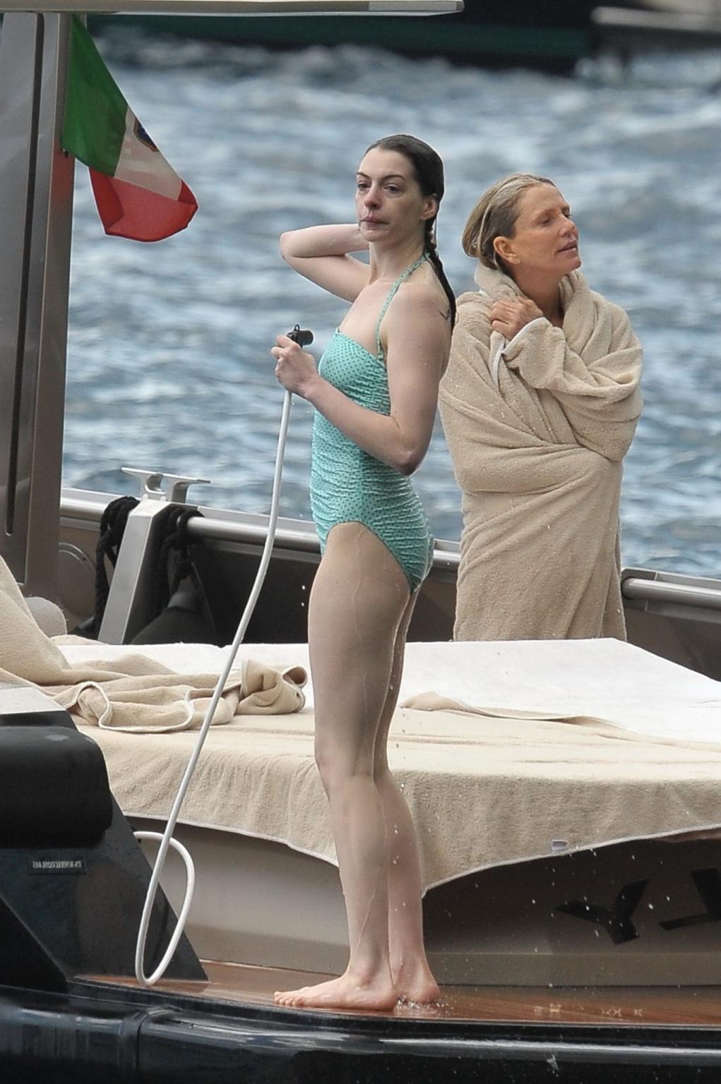 16P Anne Hathaway shows pokies wearing skimpy wet swimsuit in Italy